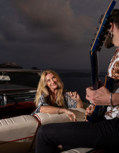 Couple enjoying a vintage car experience in Santorini
